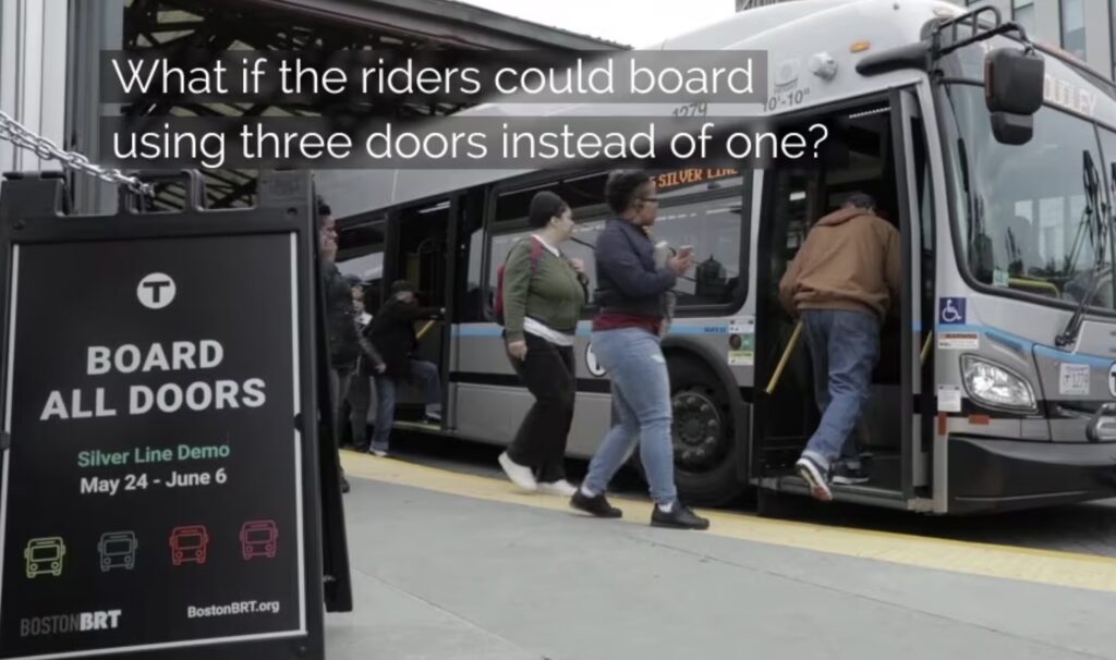 Riders board a bus.
